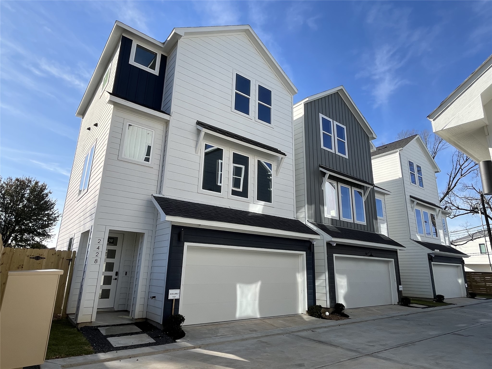 The striking façade is 2428 Freeman St., of the six homes in the community. It showcases a modern three-story design, offering 3 bedrooms, 3.5 bathrooms, and a dedicated study, with clean lines and contemporary architecture that reflect stylish urban living.