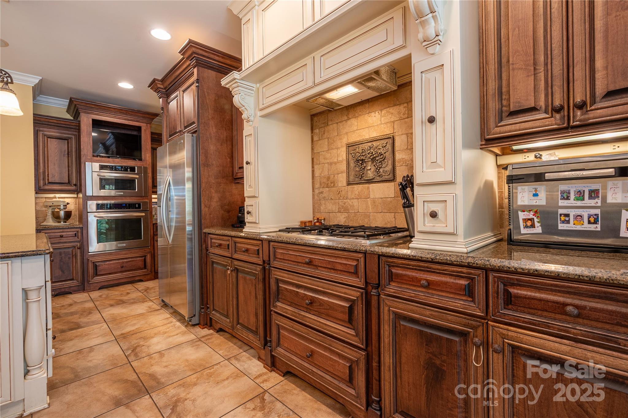 1427 Merrimont Avenue Kings Mountain, NC 28086 - Photo 18 of 48 a kitchen with stainless steel appliances granite countertop a refrigerator and a sink