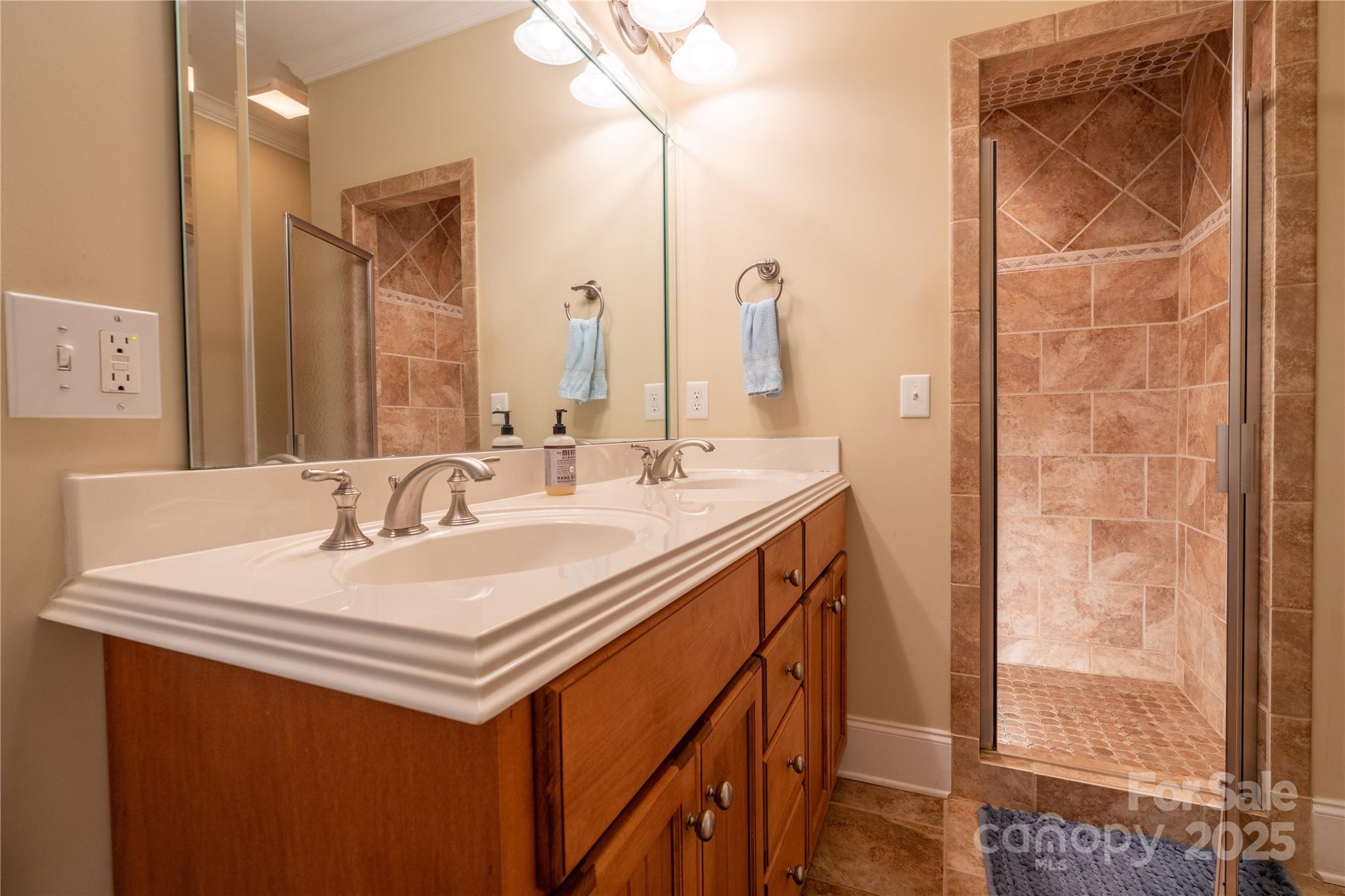 1427 Merrimont Avenue Kings Mountain, NC 28086 - Photo 29 of 48 a bathroom with a sink a vanity and a mirror