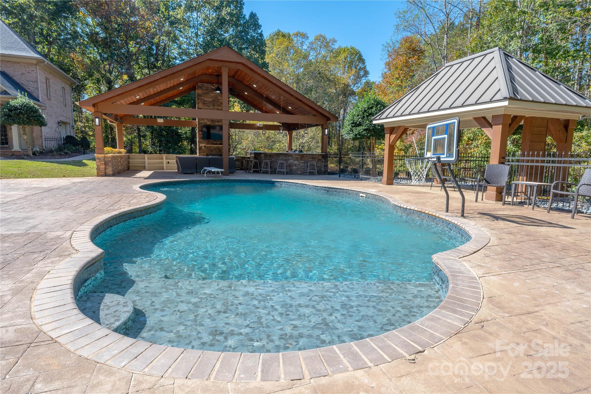 1427 Merrimont Avenue Kings Mountain, NC 28086 - Photo 5 of 48 a view of a house with a swimming pool lawn chairs and a yard