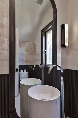 a bedroom with a large bed and a large window