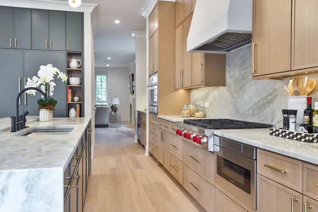 a kitchen with a sink cabinets and a stove