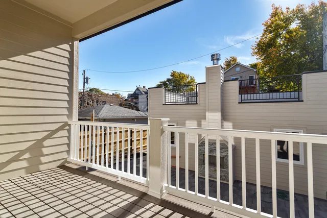 a living room with furniture a window and a floor to ceiling window