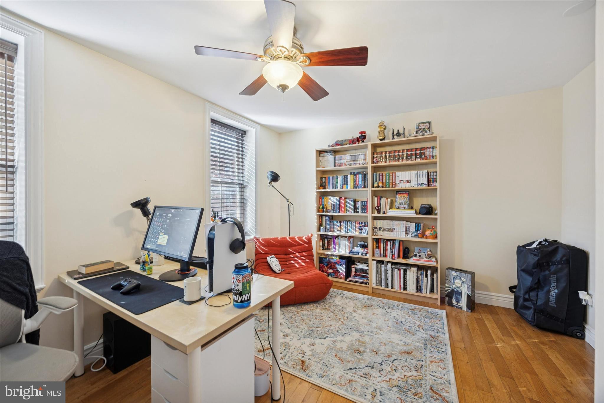 341 Dickinson Street Philadelphia, PA 19147 - Photo 12 of 27 a bedroom with furniture and a book shelf