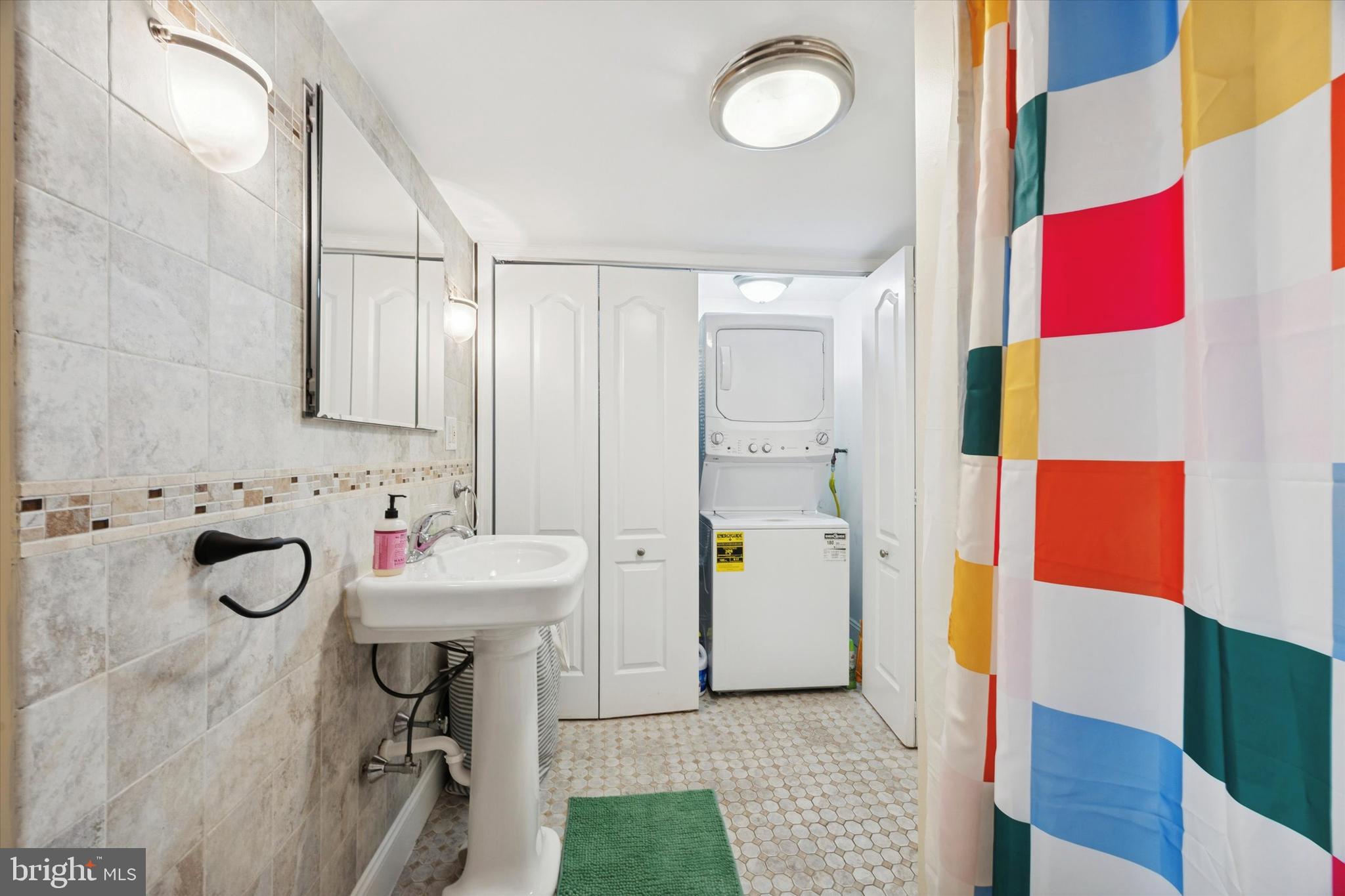 341 Dickinson Street Philadelphia, PA 19147 - Photo 17 of 27 a bathroom with a sink mirror and tub