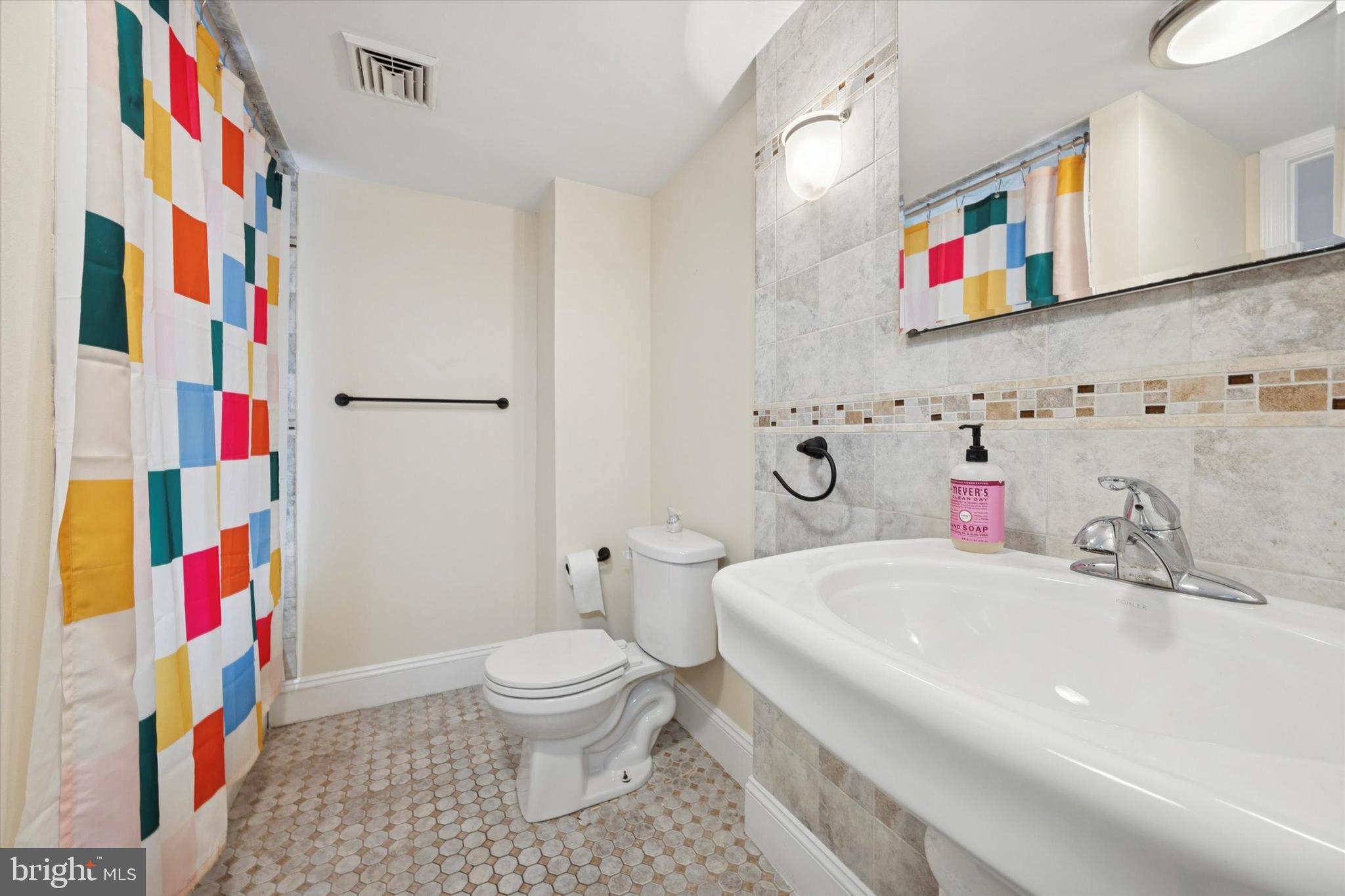 341 Dickinson Street Philadelphia, PA 19147 - Photo 18 of 27 a bathroom with a sink and a toilet