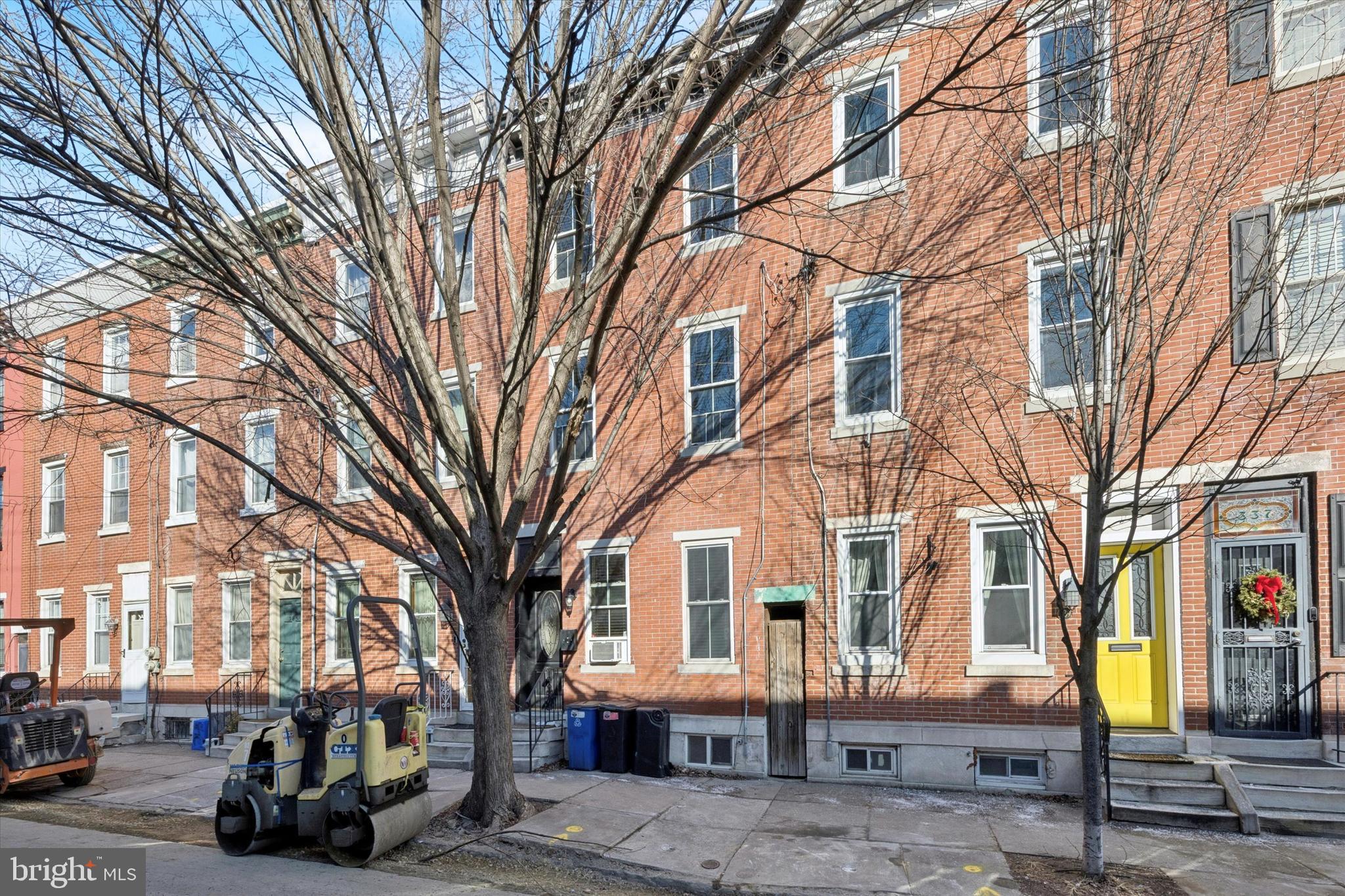 341 Dickinson Street Philadelphia, PA 19147 - Photo 2 of 27 a front view of a building with large trees