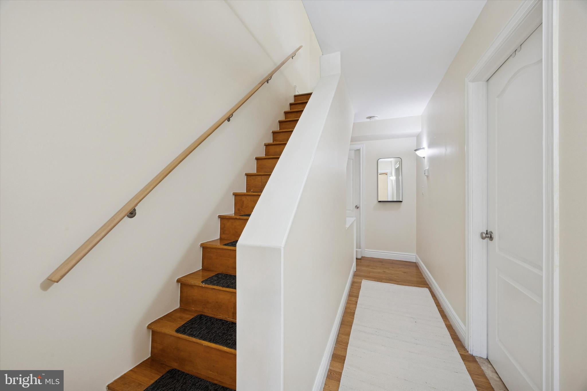 341 Dickinson Street Philadelphia, PA 19147 - Photo 21 of 27 a view of entryway with wooden floor and stairs
