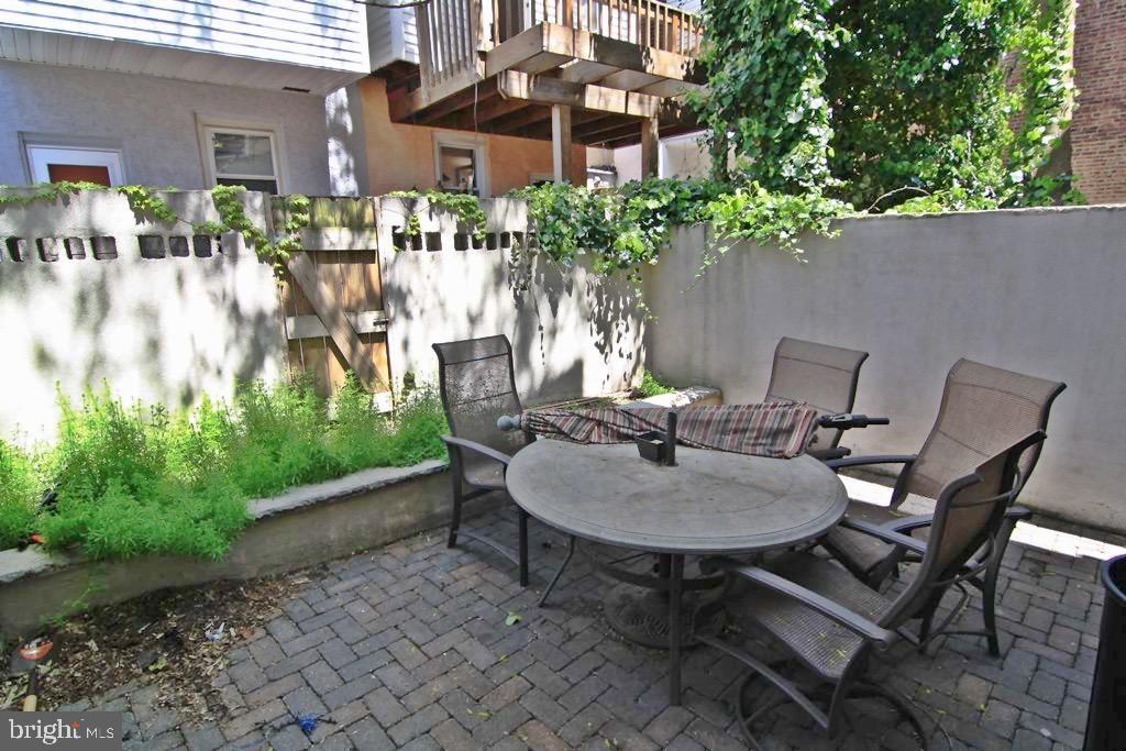 341 Dickinson Street Philadelphia, PA 19147 - Photo 10 of 27 a view of a patio with table and chairs and potted plants