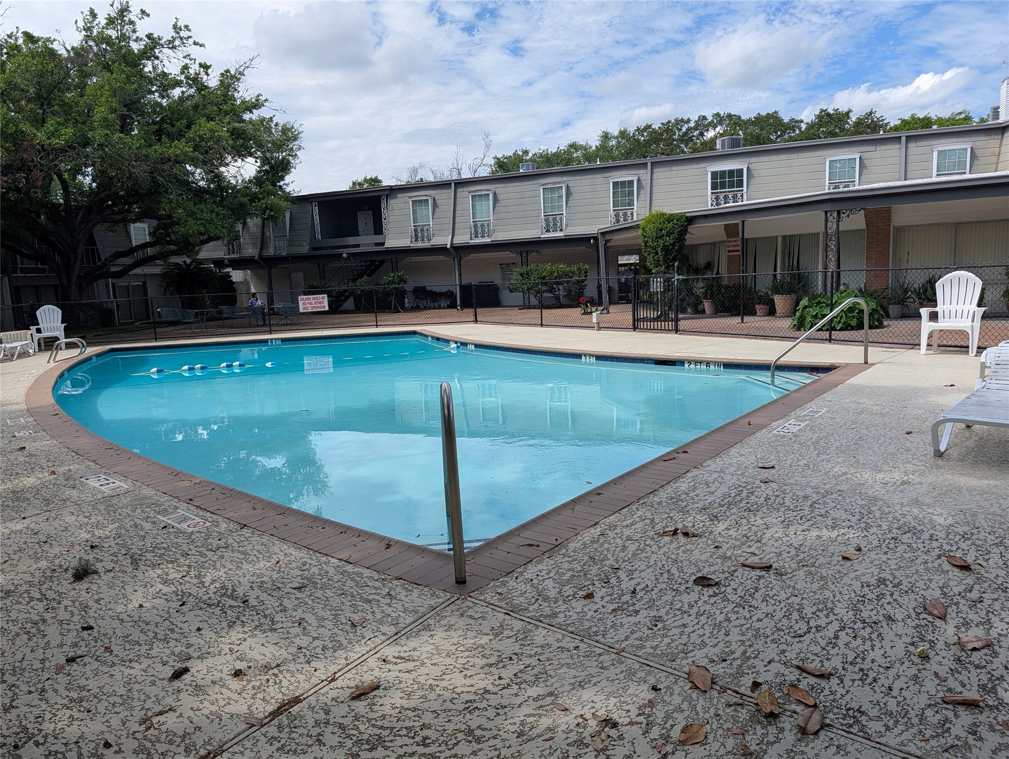 9017 Rue Cambon Street, Unit 98 Houston, TX 77074 - Photo 5 of 11 an outdoor space with swimming pool and furniture