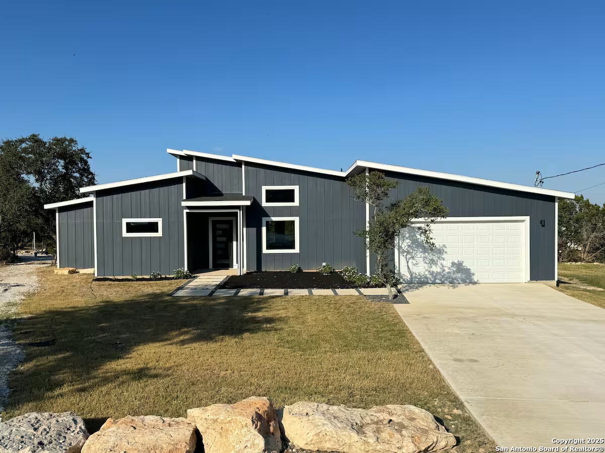 1652 Rimrock Cove Spring Branch, TX 78070 - Photo 1 of 26 a front view of a house