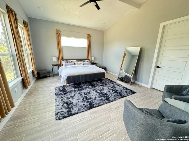 a living room with furniture and a rug
