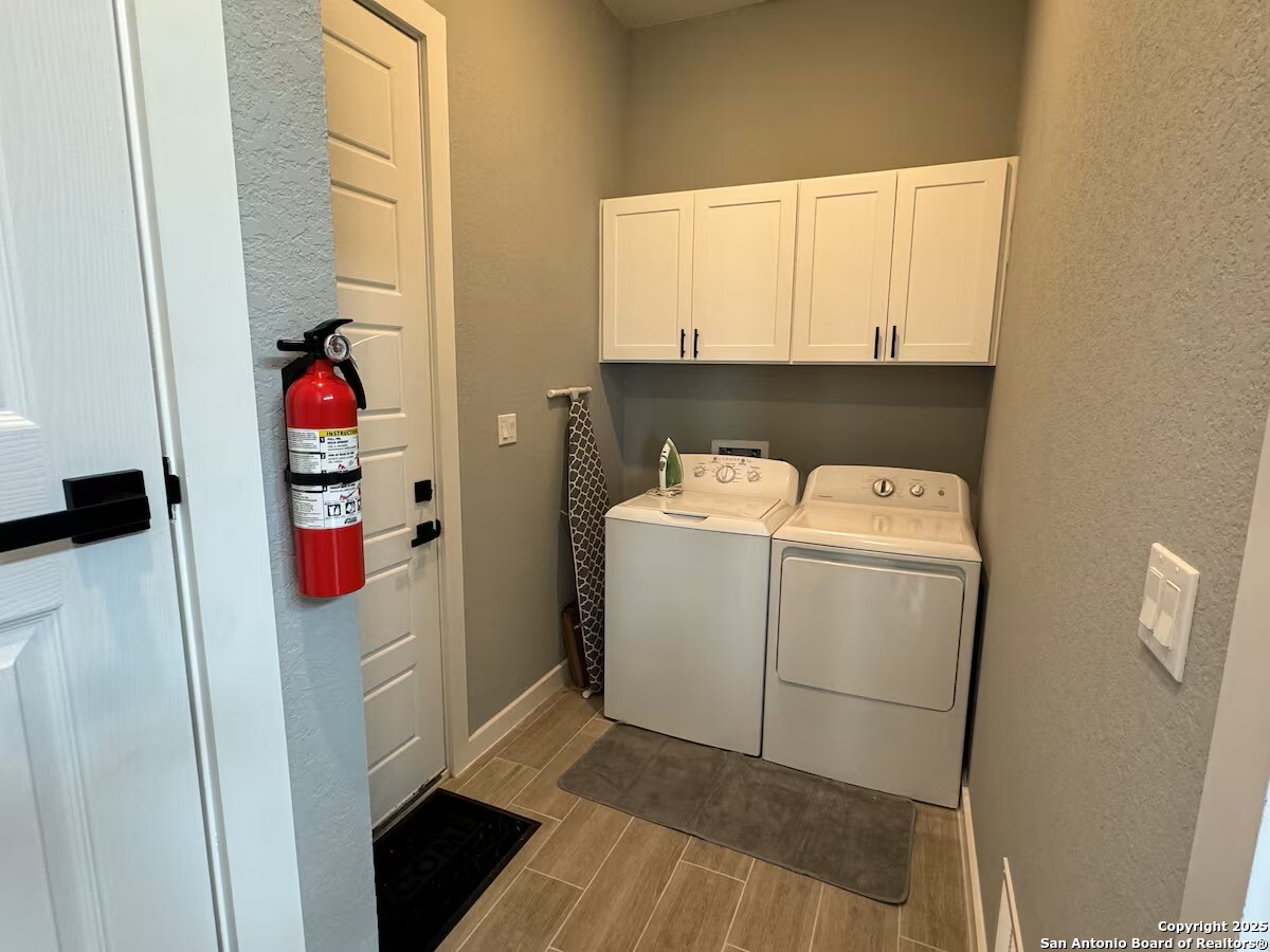 1652 Rimrock Cove Spring Branch, TX 78070 - Photo 19 of 26 a utility room with dryer and washer