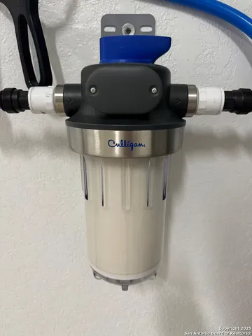 a living room with patio furniture and a floor to ceiling window