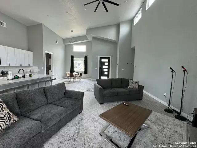 a living room with furniture and a rug