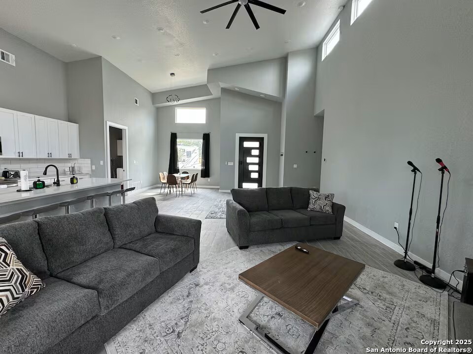1652 Rimrock Cove Spring Branch, TX 78070 - Photo 3 of 26 a living room with furniture and a rug