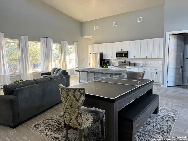 a kitchen with a stove cabinets and refrigerator