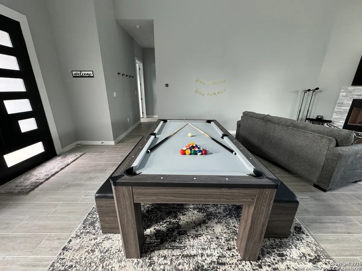 1652 Rimrock Cove Spring Branch, TX 78070 - Photo 7 of 26 a bed sitting in a bedroom next to a window