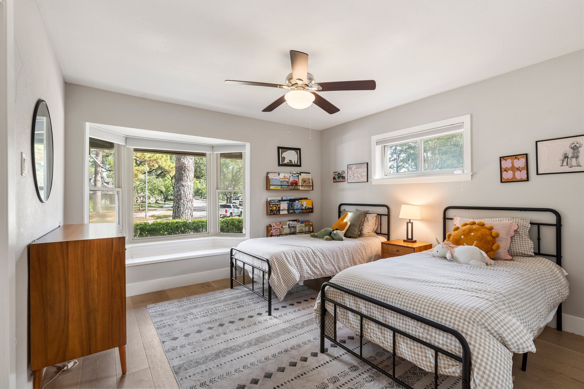 4423 Apollo Street Houston, TX 77018 - Photo 16 of 34 The first of 3 guest rooms features a large window, ceiling fan with light kit and a neutral color palette. Ample room to customize the layout to suit your needs.