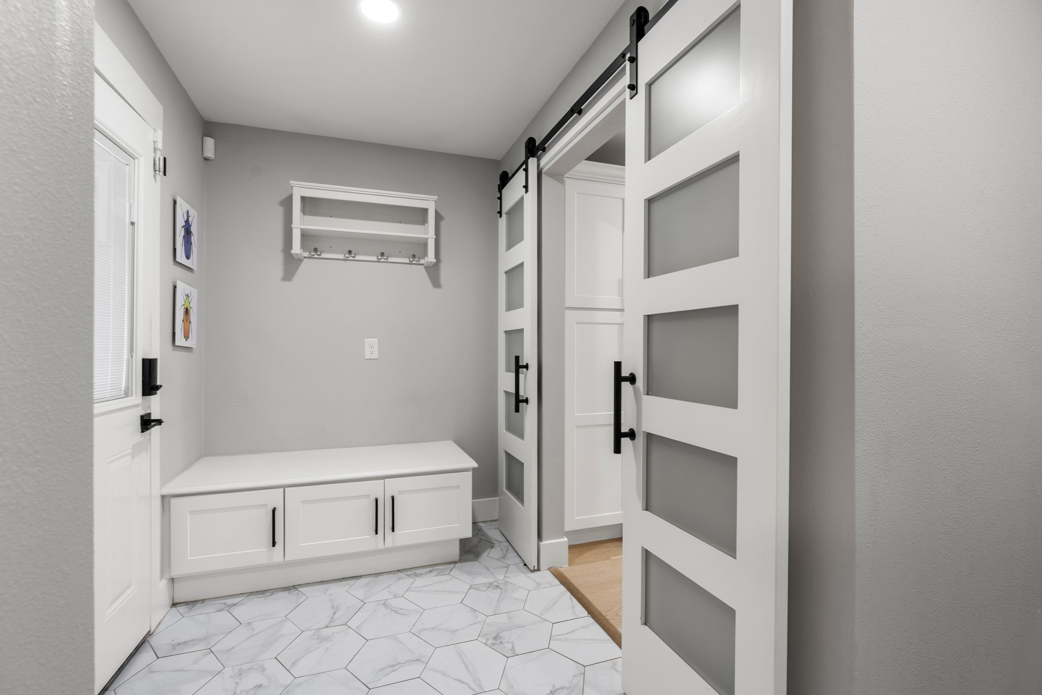 4423 Apollo Street Houston, TX 77018 - Photo 21 of 34 Chic and functional mudroom with bench storage perfect for keeping everyday essentials organized.