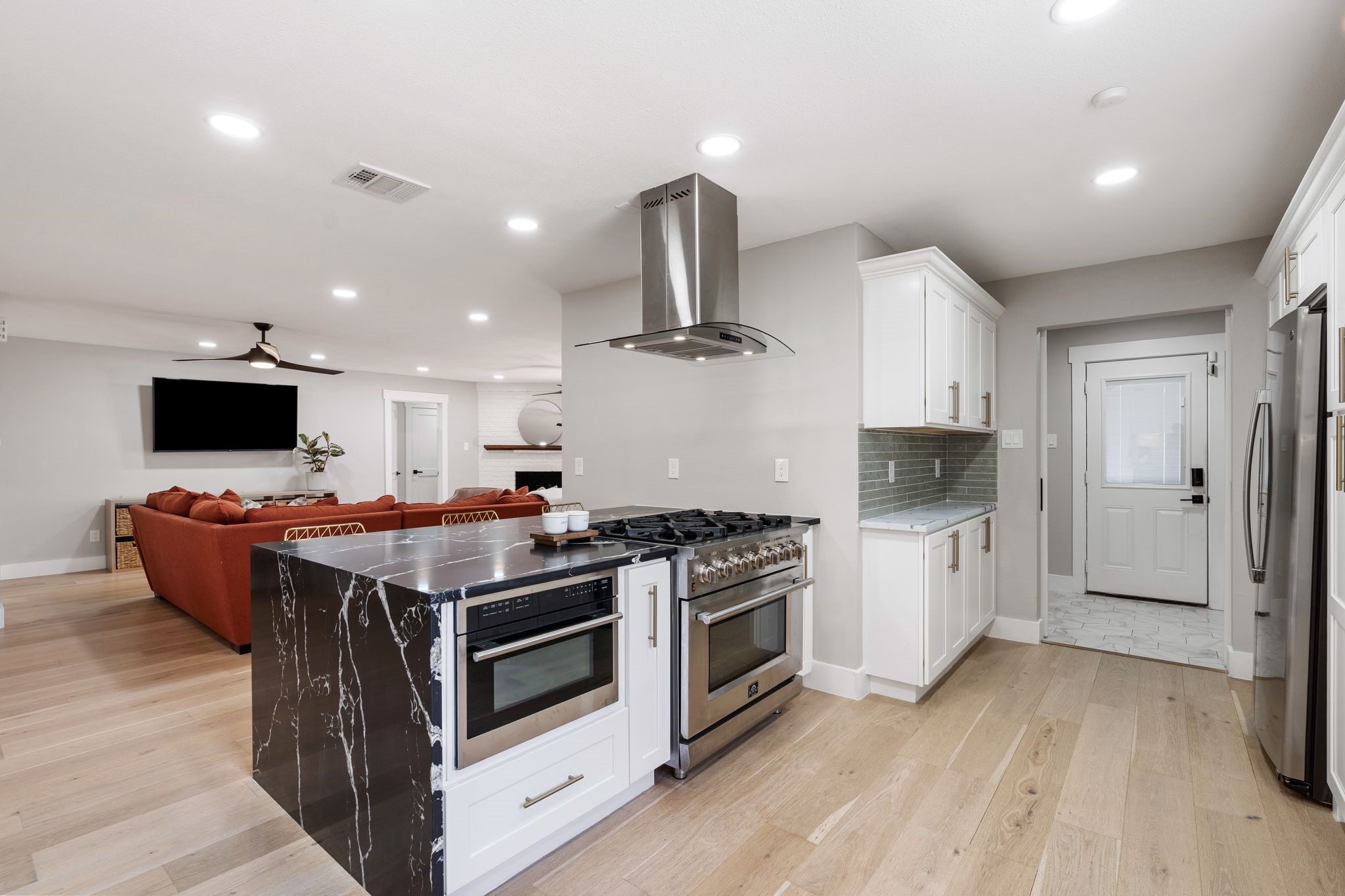 4423 Apollo Street Houston, TX 77018 - Photo 9 of 34 Chef's kitchen featuring a 6-burner Forno range with built-in air fryer and convection oven and drawer microwave/convection oven.