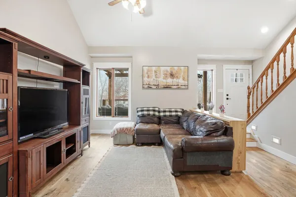 a view of a livingroom with furniture and a dining table