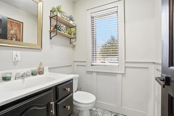 a kitchen with a sink appliances and cabinets