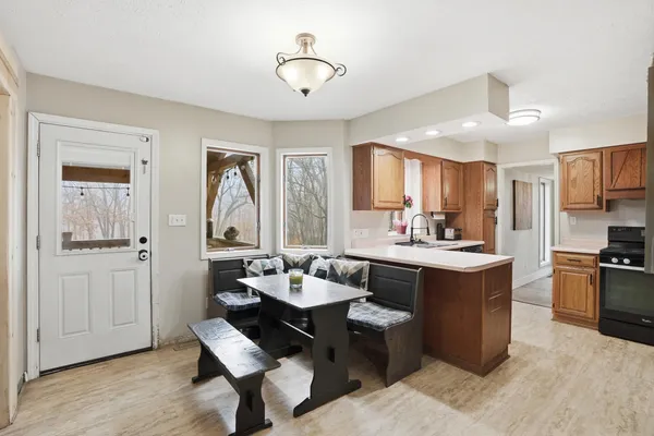 a kitchen with granite countertop a sink and cabinets