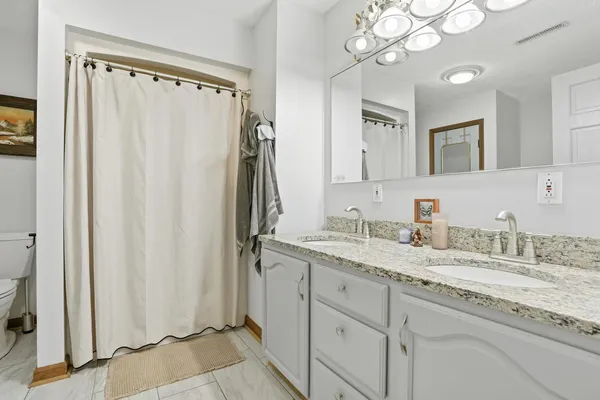a bath tub sitting next to a shower