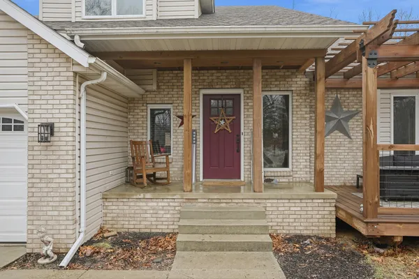 a front view of a house with a outdoor seating