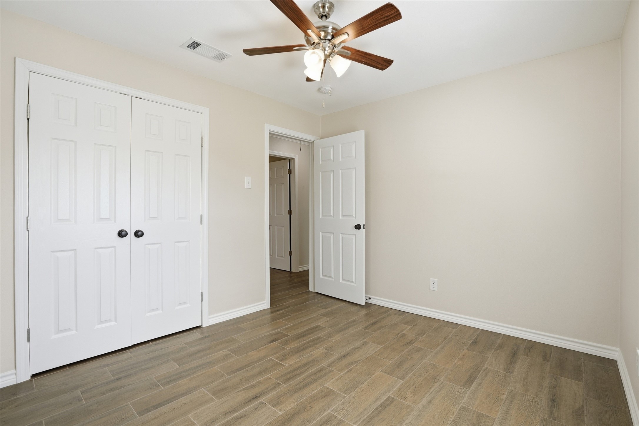 6518 Paris Street Houston, TX 77021 - Photo 6 of 23 wooden floor in an empty room