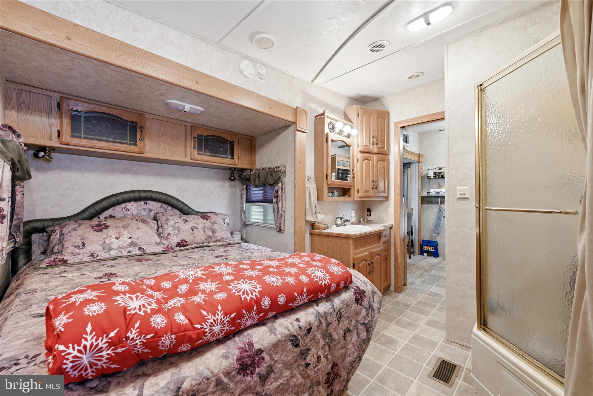 Lot 20 Hot Dog Road Falling Waters, WV 25419 - Photo 11 of 26 a bedroom with a large bed and a dresser