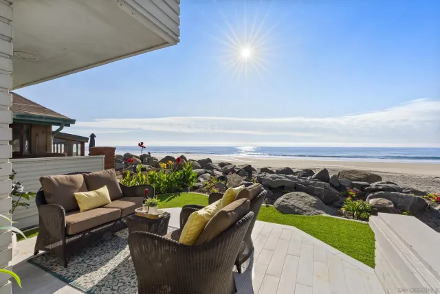 a bedroom with a large bed and a couch