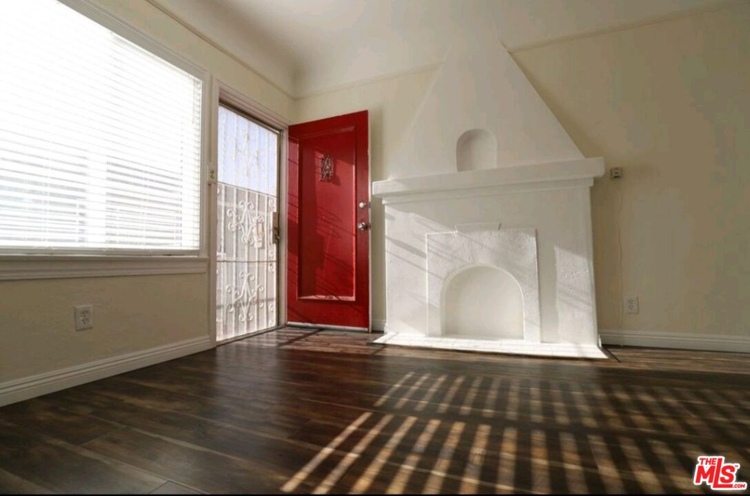 4124 Monroe Street Los Angeles, CA 90029 - Photo 12 of 29 an empty room with wooden floor and windows