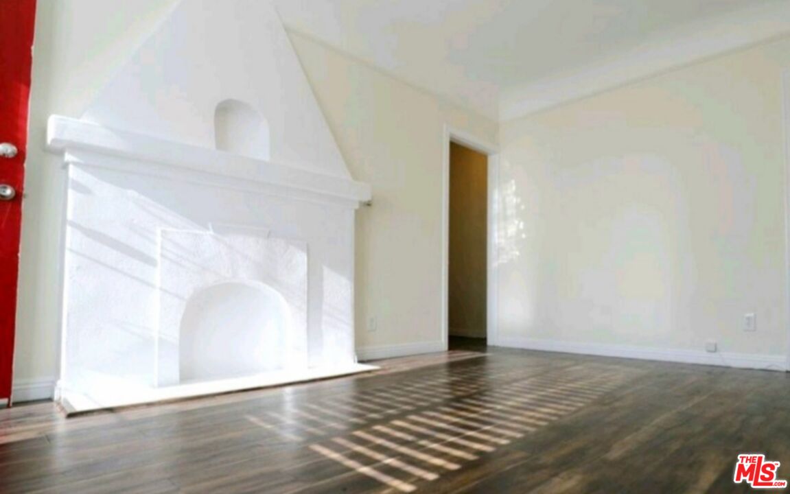 4124 Monroe Street Los Angeles, CA 90029 - Photo 15 of 29 a view of an empty room with wooden floor and a window