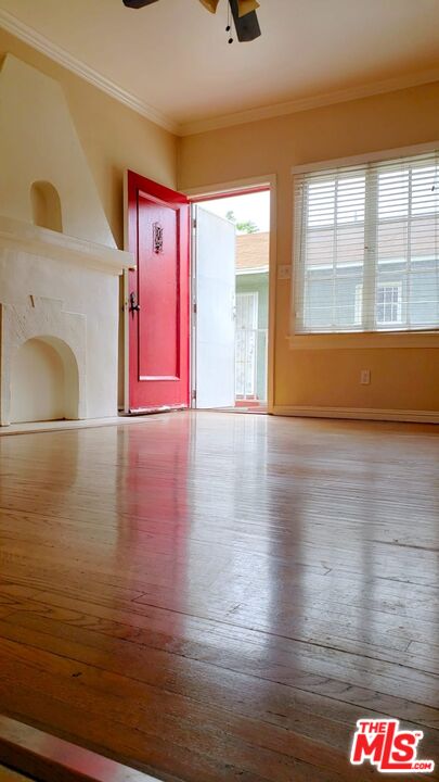 4124 Monroe Street Los Angeles, CA 90029 - Photo 10 of 29 a view of an empty room with a window and wooden floor