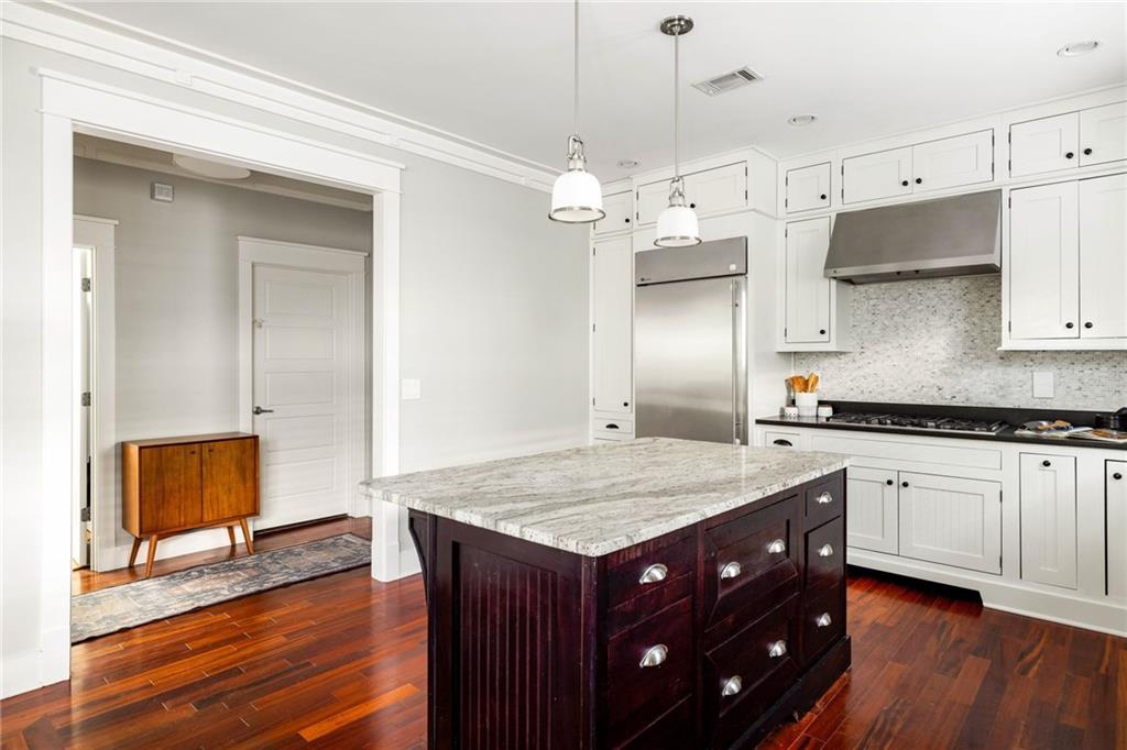 266 Atlanta Avenue Southeast Atlanta, GA 30315 - Photo 27 of 70 a kitchen with a sink a center island cabinets and wooden floor