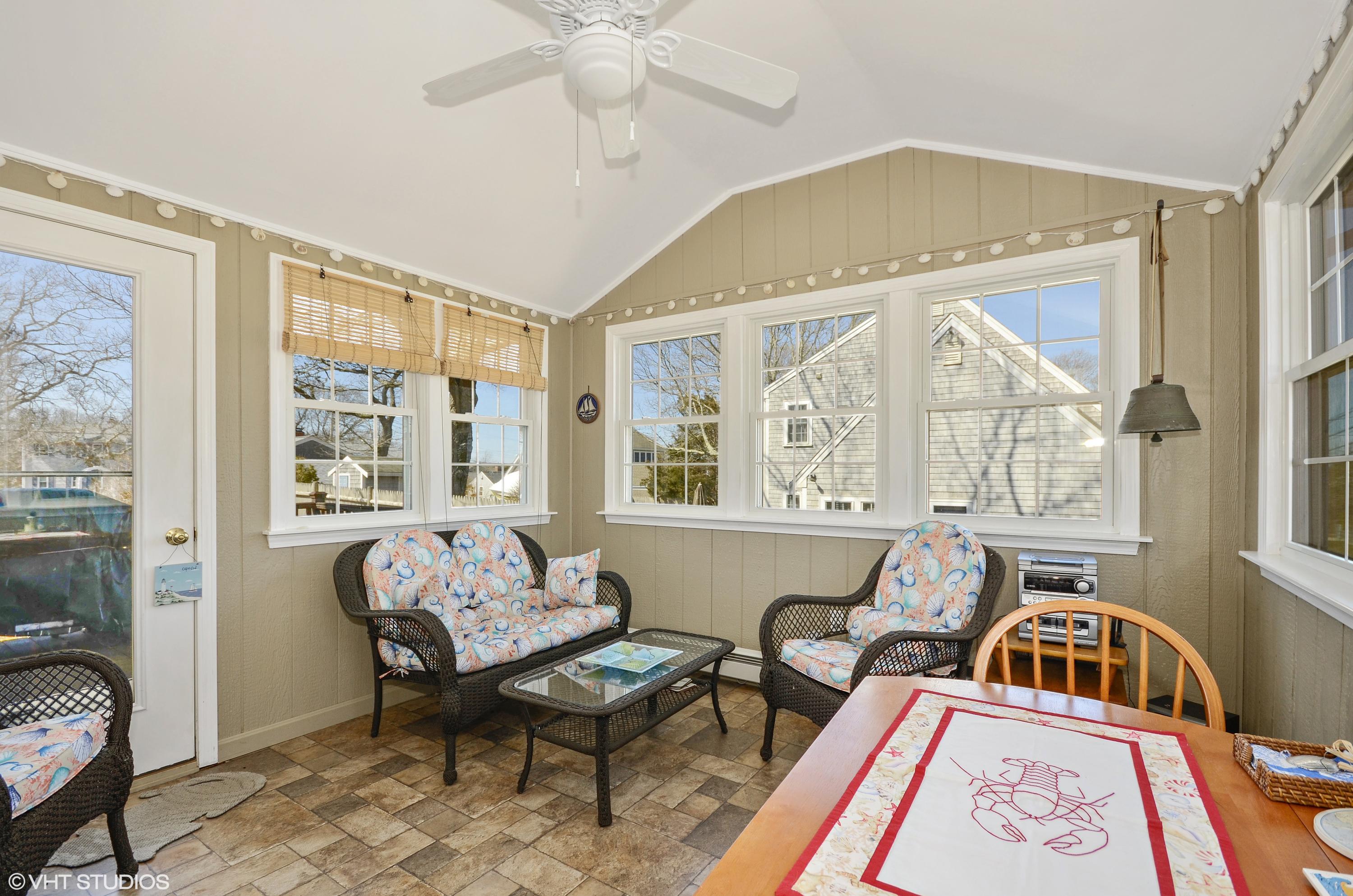 99 Mashnee Road Bourne, MA 02532 - Photo 12 of 25 a living room with furniture and a window