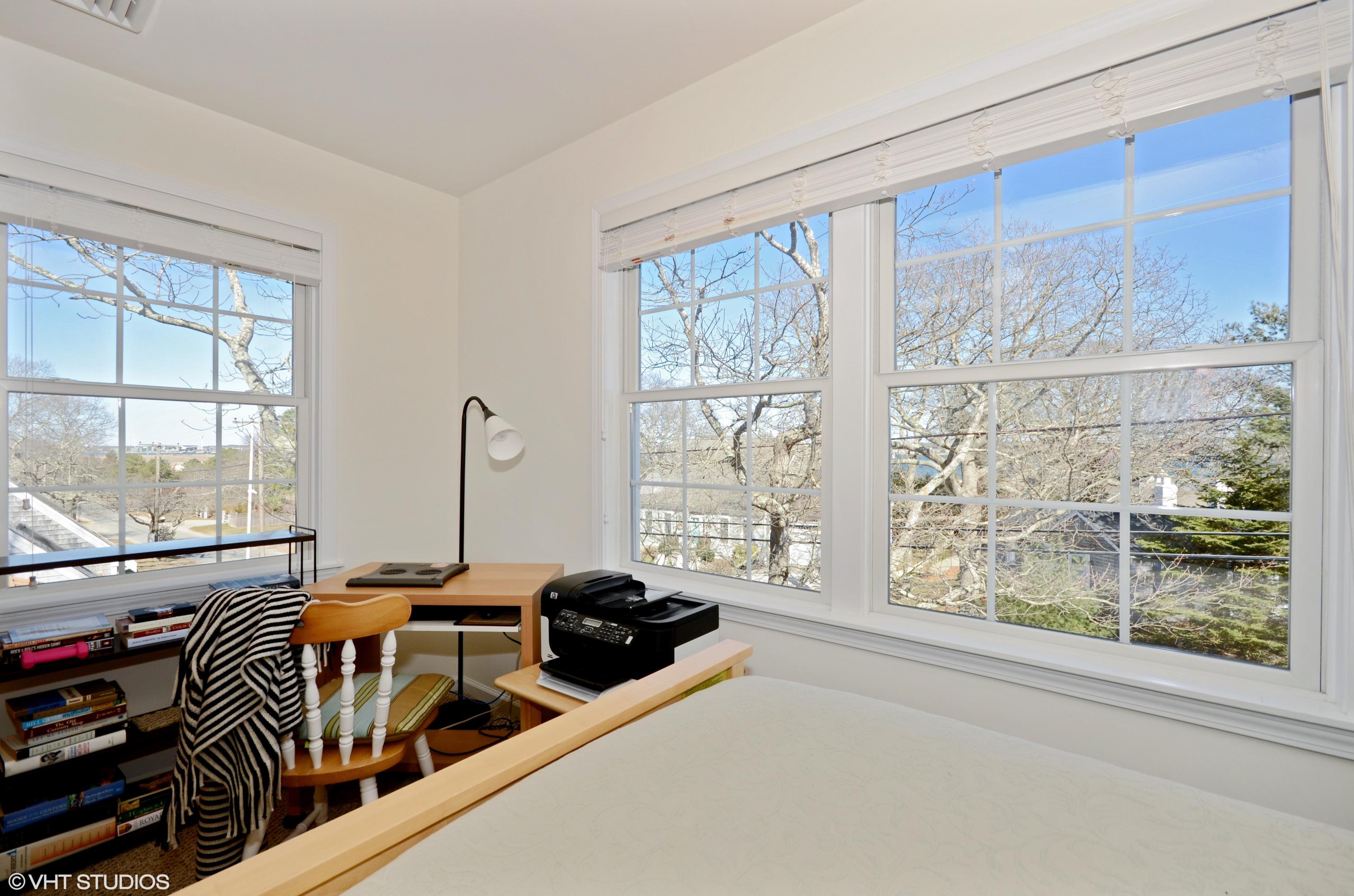99 Mashnee Road Bourne, MA 02532 - Photo 15 of 25 a view of a livingroom with furniture and windows
