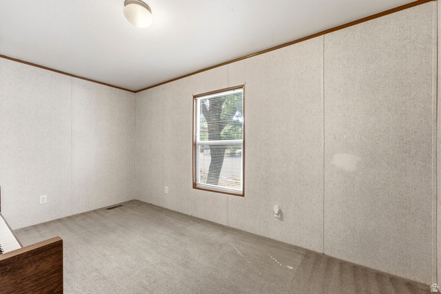 2875 North Hill Field Road, Unit 62 Layton, UT 84041 - Photo 24 of 34 Room with light-toned wall paneling and a carpeted floor