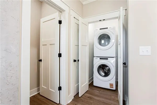 a view of a hallway with washer and dryer
