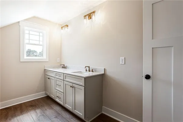 a utility room with cabinets washer and dryer