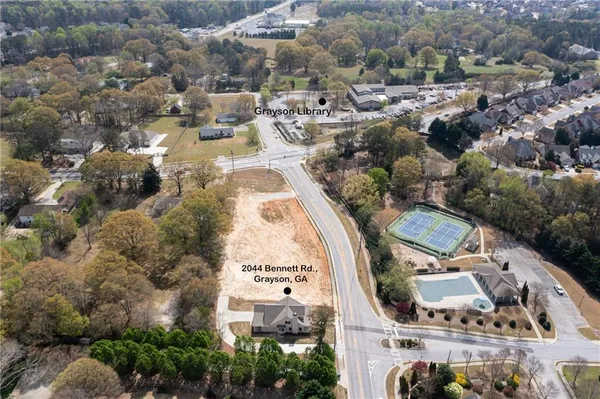 an aerial view of residential houses with outdoor space