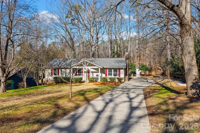 a front view of a building with a garden