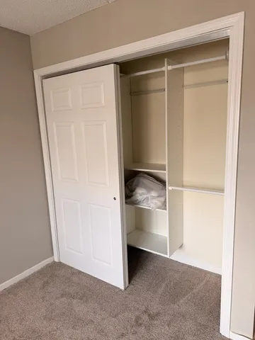 a view of room with window and hardwood floor