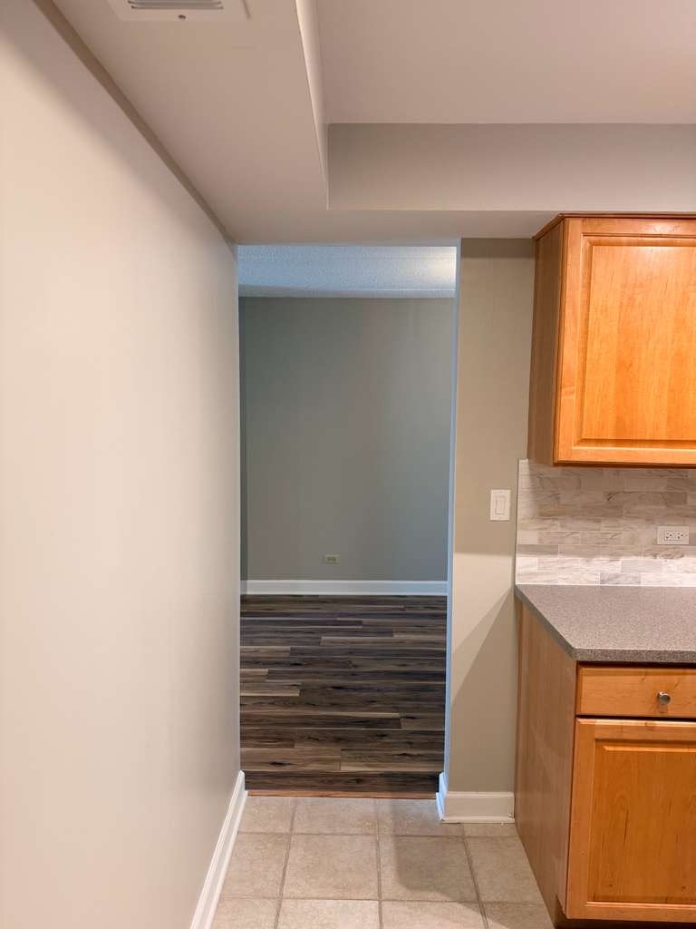 2066 St Johns Avenue, Unit 304 Highland Park, IL 60035 - Photo 8 of 18 a kitchen with a sink and a refrigerator