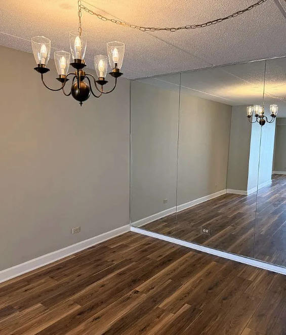 2066 St Johns Avenue, Unit 304 Highland Park, IL 60035 - Photo 9 of 18 a view of a room with wooden floor