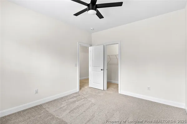 a view of a room with a ceiling fan