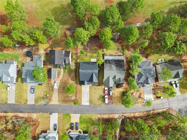 an aerial view of residential houses with outdoor space