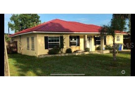 910 Lake Avenue Edgewater, FL 32132 - Photo 3 of 23 a black and white house with a yard
